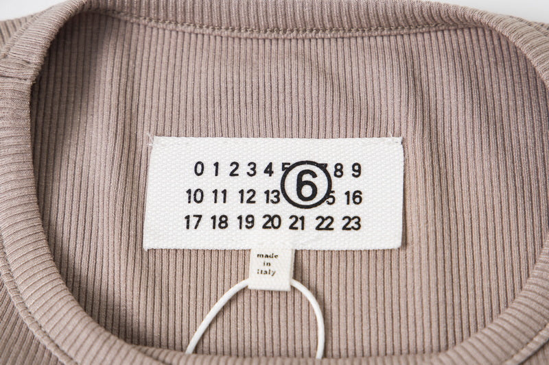 Beige T-shirt neck label with size numbers and Maison Margiela branding
