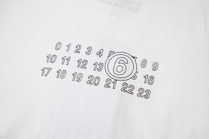 Light fabric T-shirt close-up of outlined number 6 and digits graphic