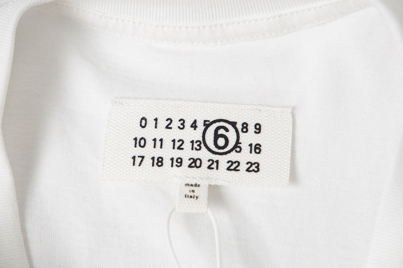 T-shirt neck label tag with size and brand details; number 6 graphic