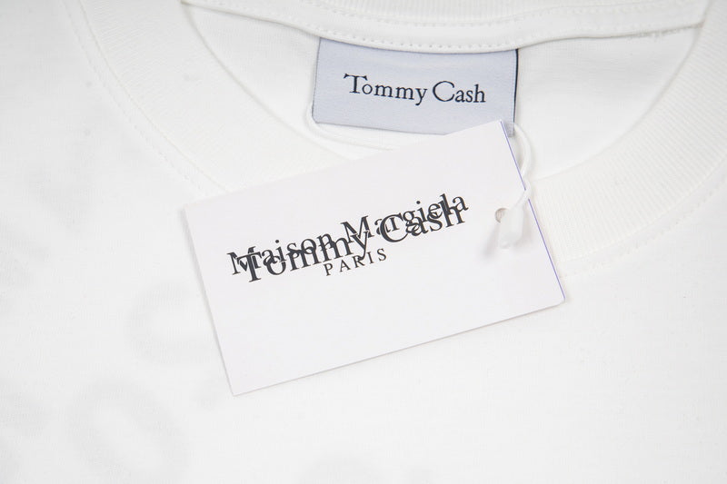 White T-shirt neckline with Tommy Cash label and care tag