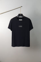 Black crew-neck T-shirt with small chest graphic, short sleeves