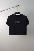 Black graphic crewneck T-shirt on hanger with small number print on chest