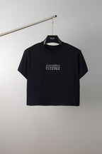 Black graphic crewneck T-shirt on hanger with small number print on chest