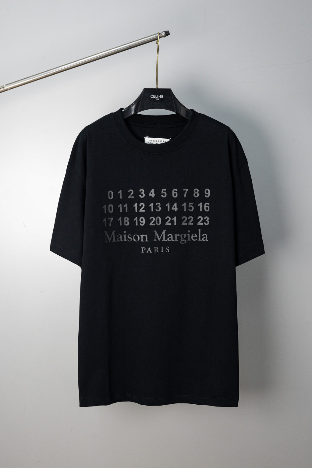 Black crewneck T-shirt with Maison Margiela number graphic and Paris text
