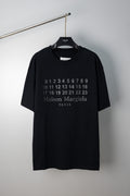 Black crewneck T-shirt with Maison Margiela number graphic and Paris text