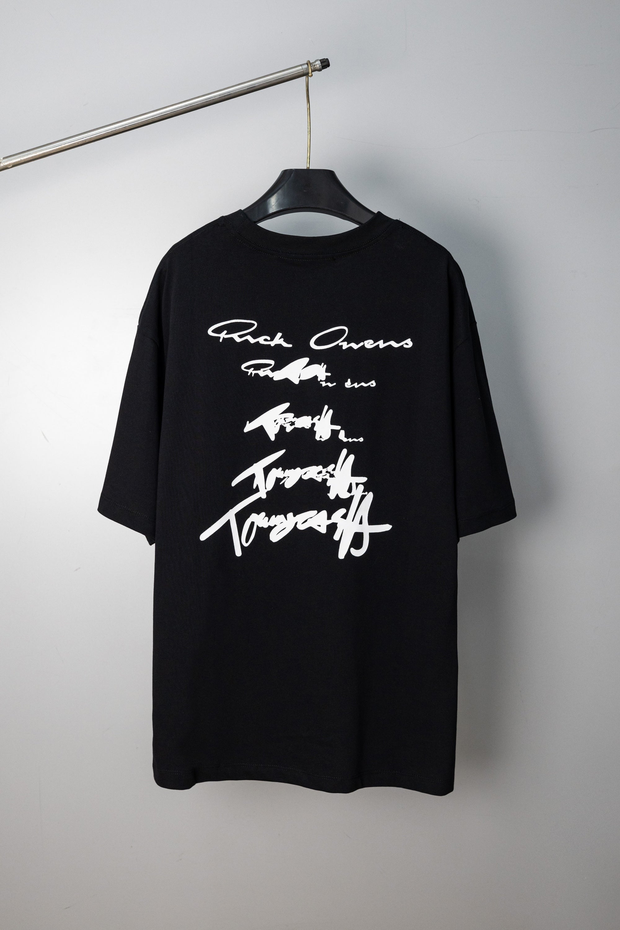 Black crewneck T-shirt with signature-style graphic print at chest