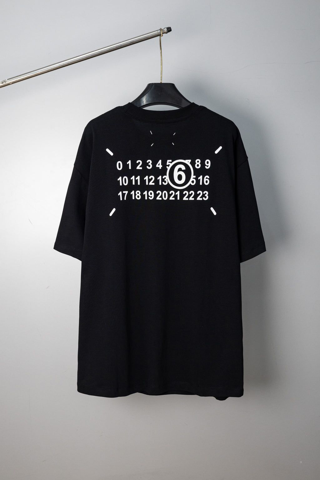 Black crew-neck T-shirt with large back numeric graphic print and short sleeves