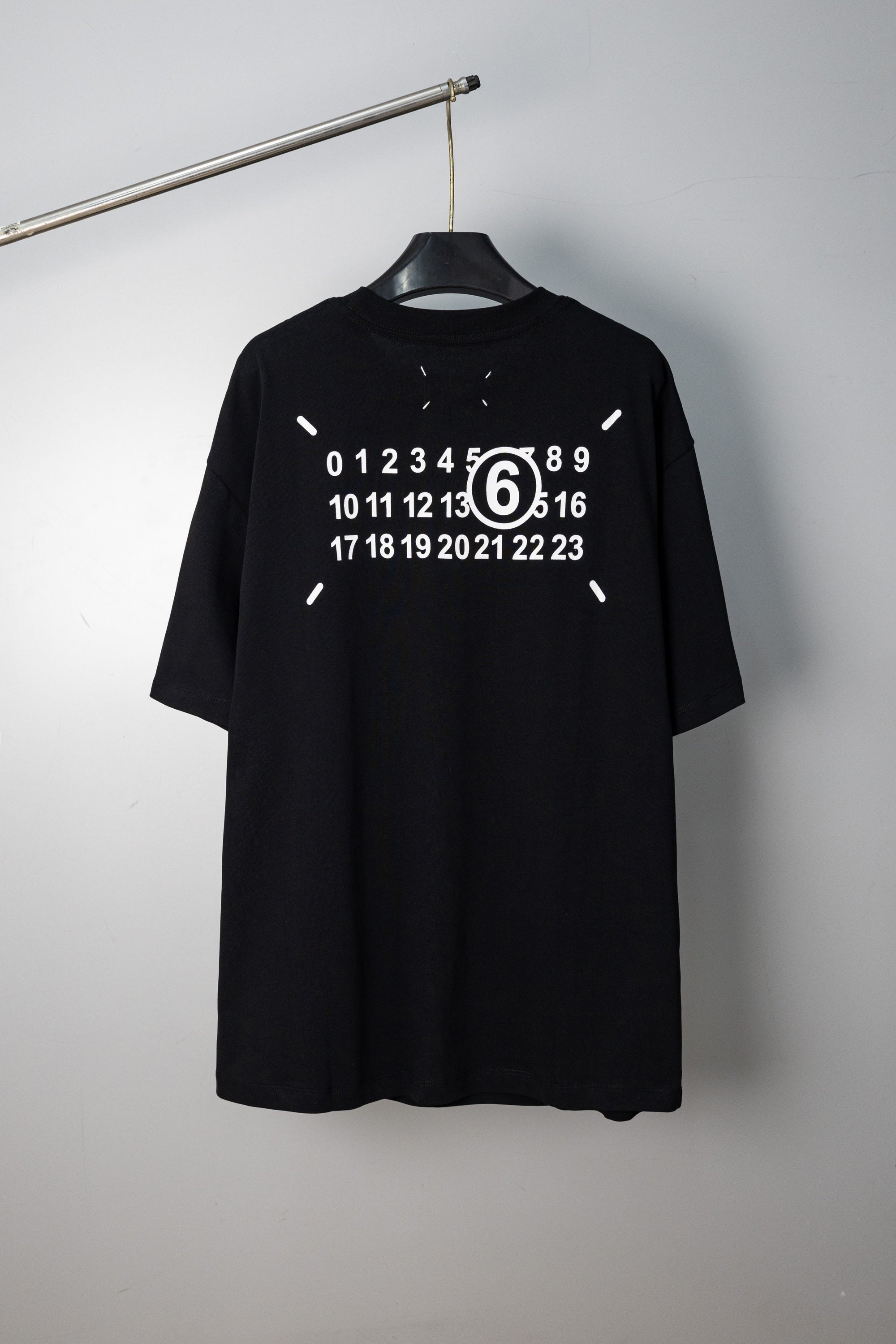 Black crew-neck T-shirt with large back numeric graphic print and short sleeves