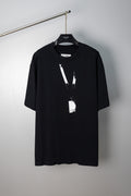 Black Maison Margiela T-shirt with abstract vertical paint graphic and hanging tag