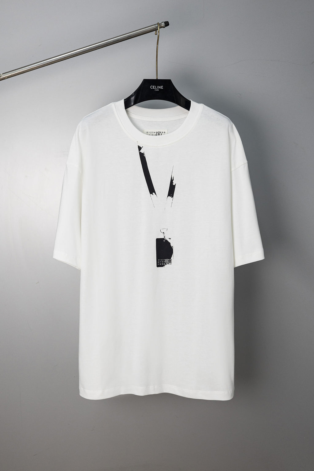 White Maison Margiela T-shirt with abstract vertical paint graphic and hanging tag