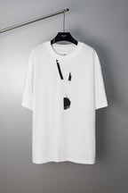 White Maison Margiela T-shirt with abstract vertical paint graphic and hanging tag