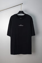 Black Maison Margiela crew-neck T-shirt with small chest logo, short sleeves.