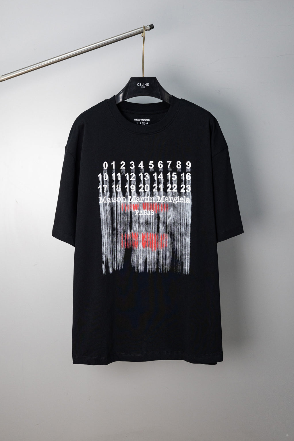 Black crew-neck T-shirt with Maison Margiela graphic print on front