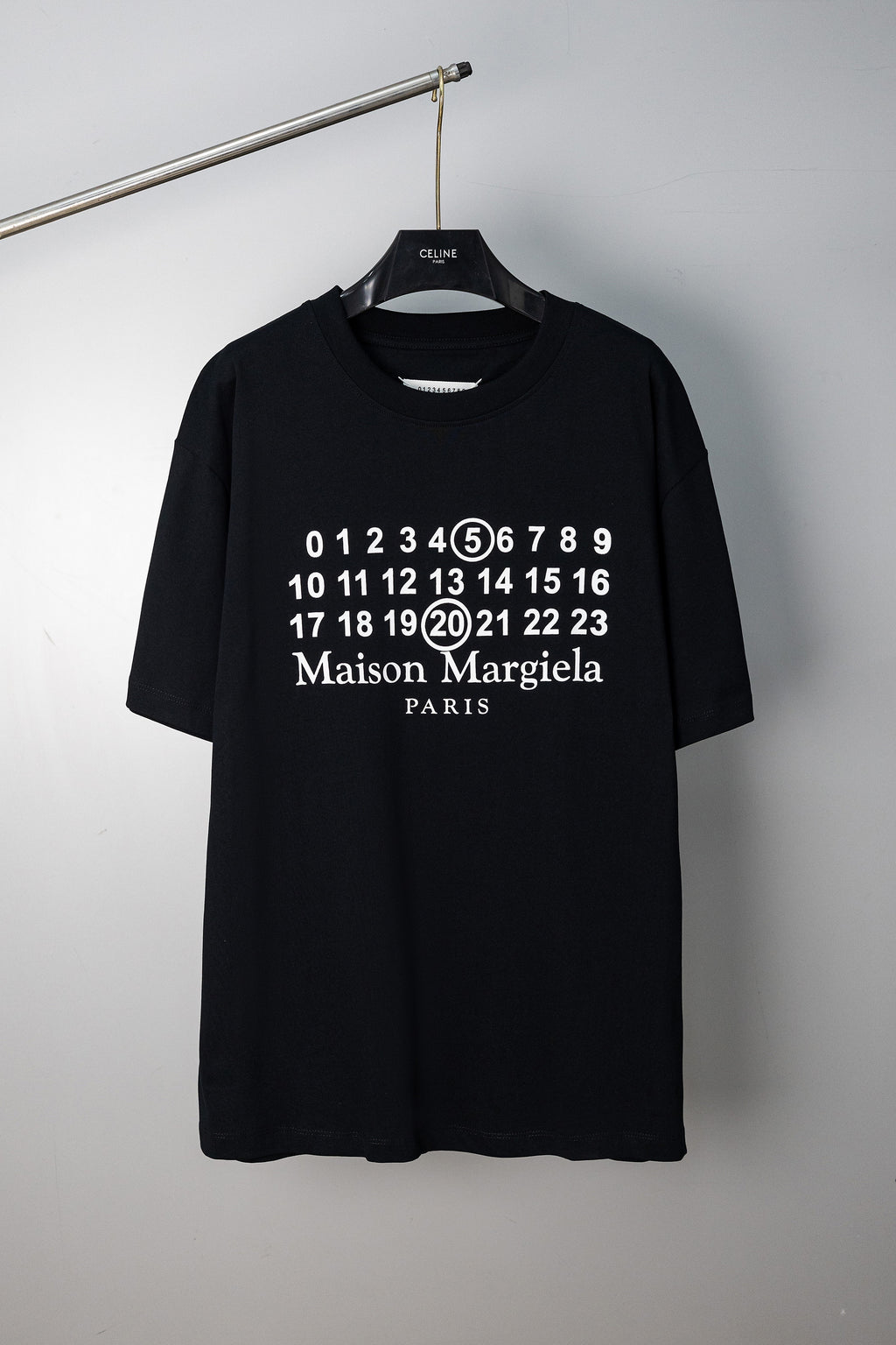 Black graphic T-shirt with numerals and "Maison Margiela" "PARIS" print on chest