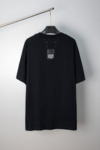 Black crew-neck T-shirt with small logo label at the back neckline