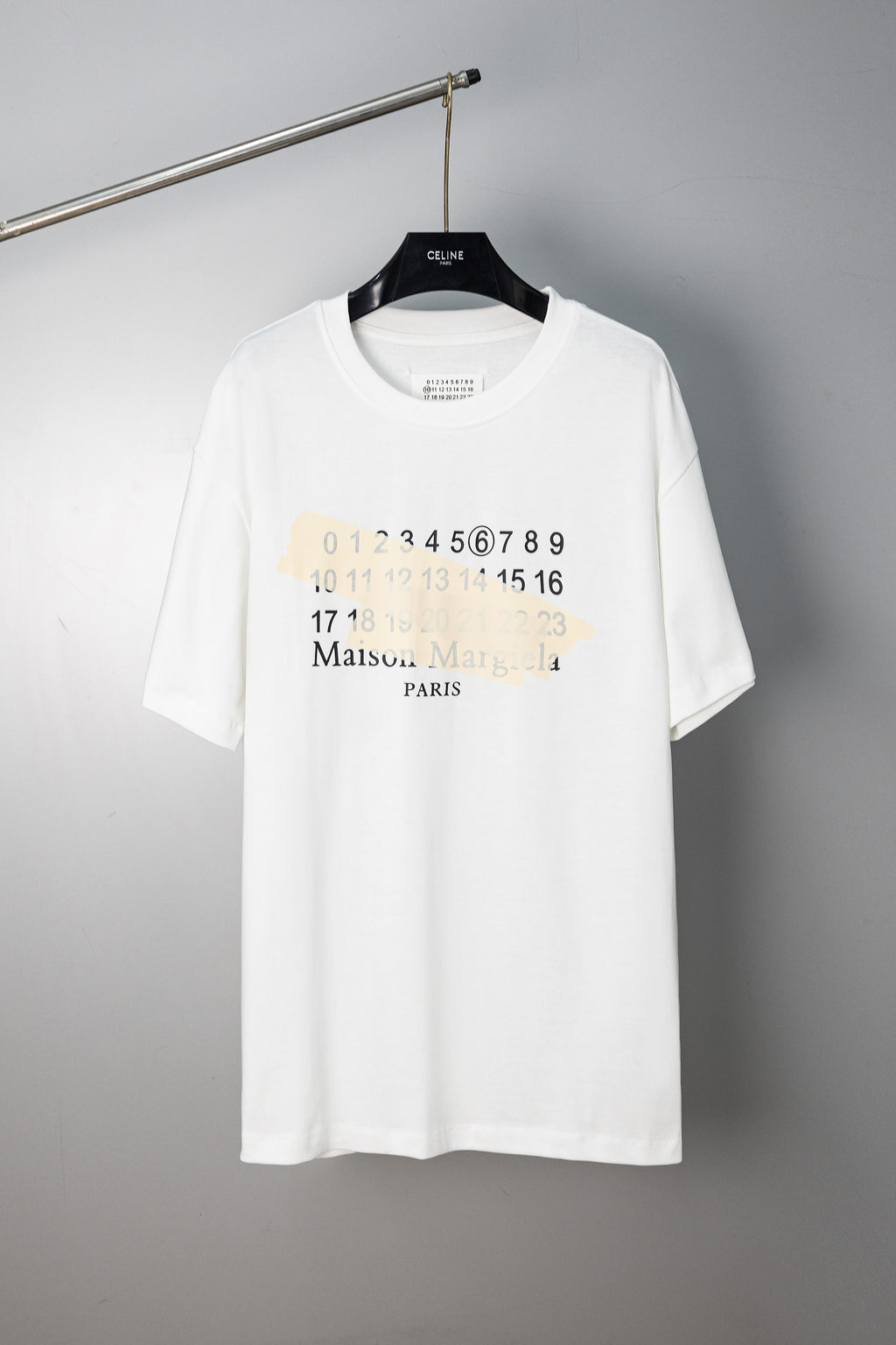 White crew-neck T-shirt with Maison Margiela number and logo graphic on front