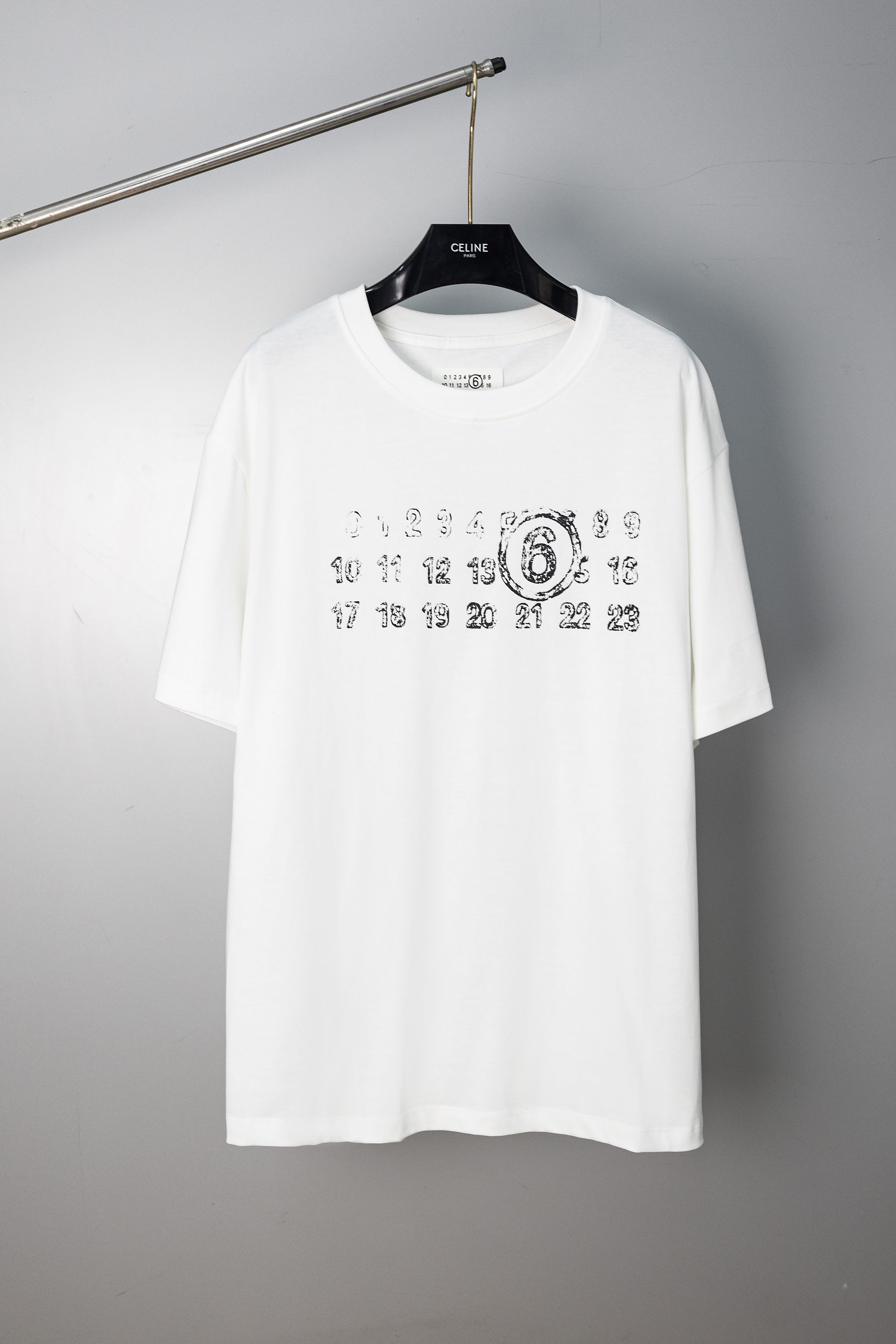 White crewneck T-shirt with black number graphic on the chest