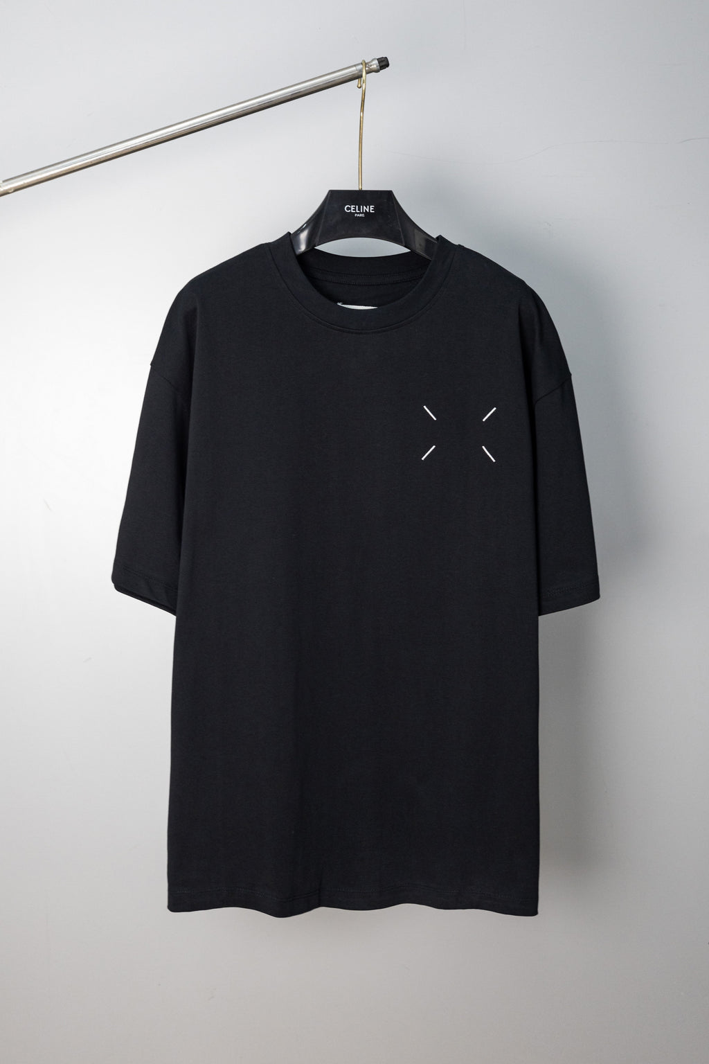 Black T-shirt with small chest arrow-like slash accents