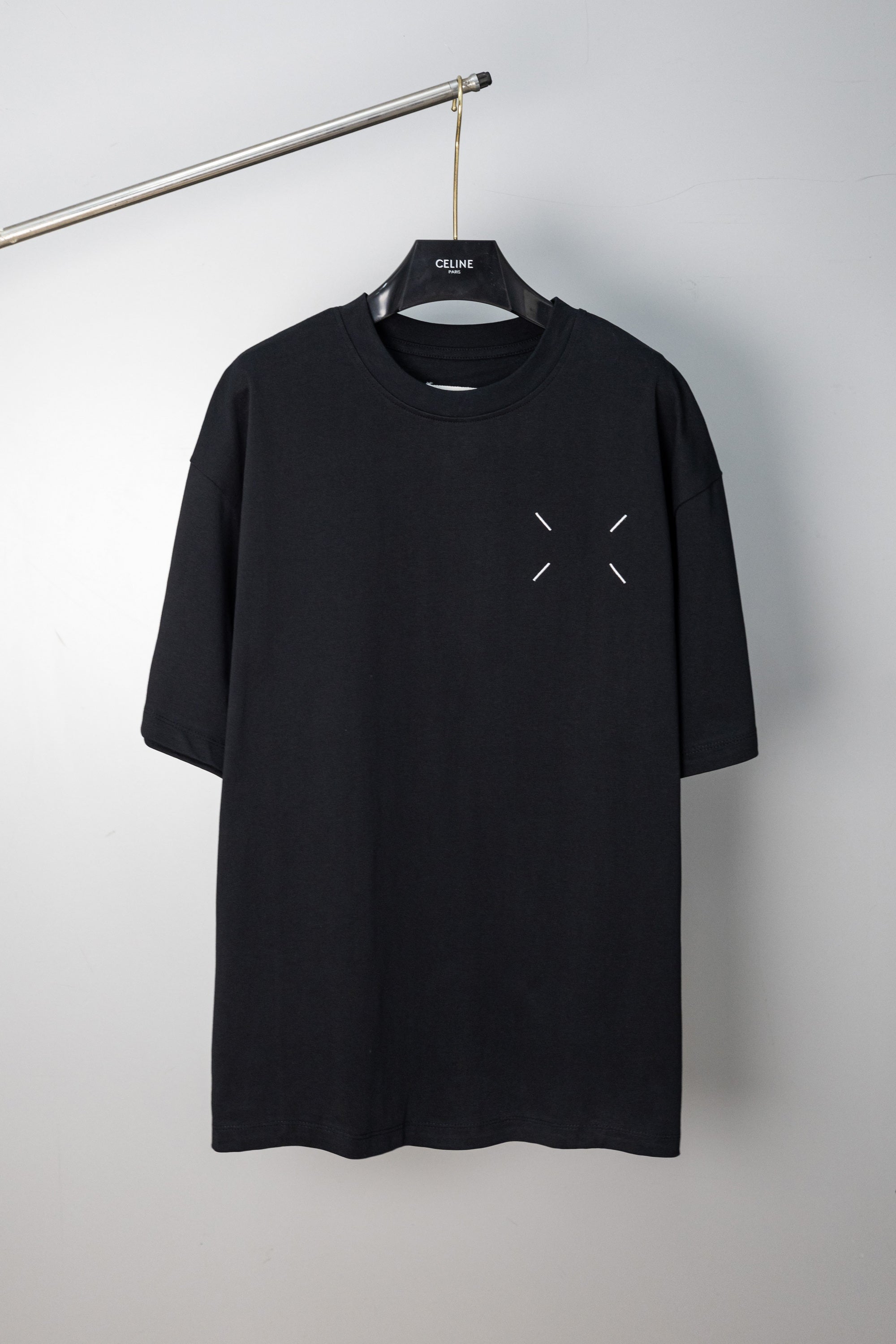 Black T-shirt with small chest arrow-like slash accents