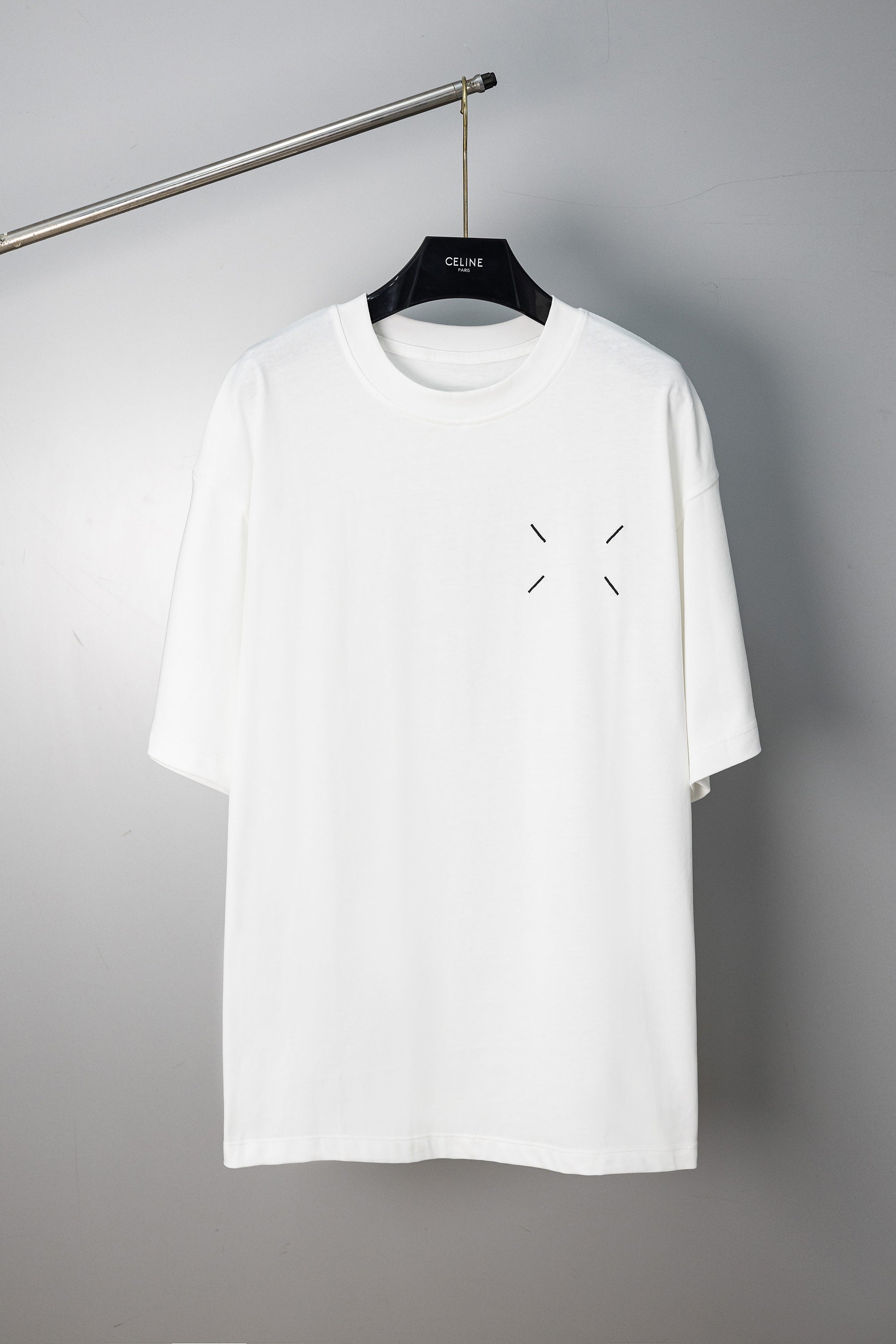 White T-shirt with small chest arrow-like slash accents
