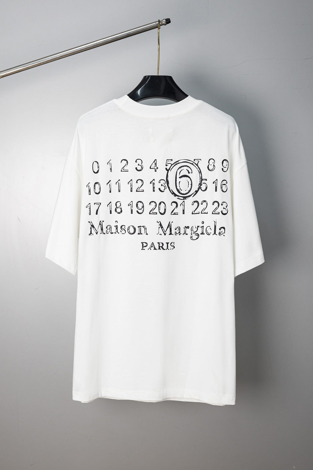 White T-shirt with “Maison Margiela Paris” number 6 graphic print at chest