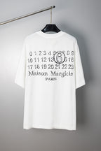 White T-shirt with “Maison Margiela Paris” number 6 graphic print at chest
