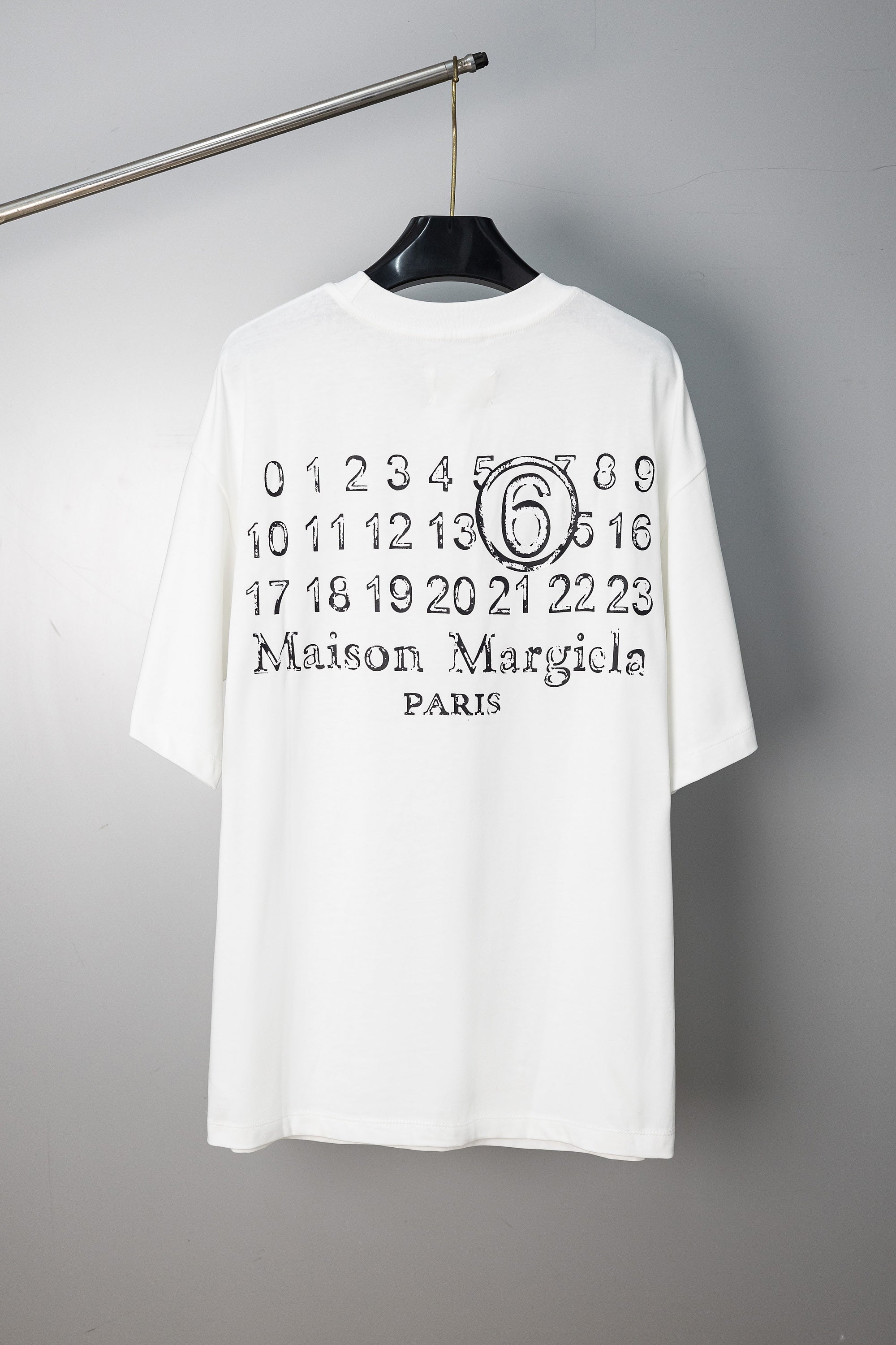 White T-shirt with “Maison Margiela Paris” number 6 graphic print at chest