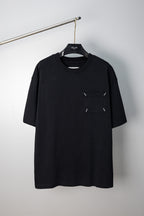 Black crew-neck T-shirt with small stitched emblem on chest