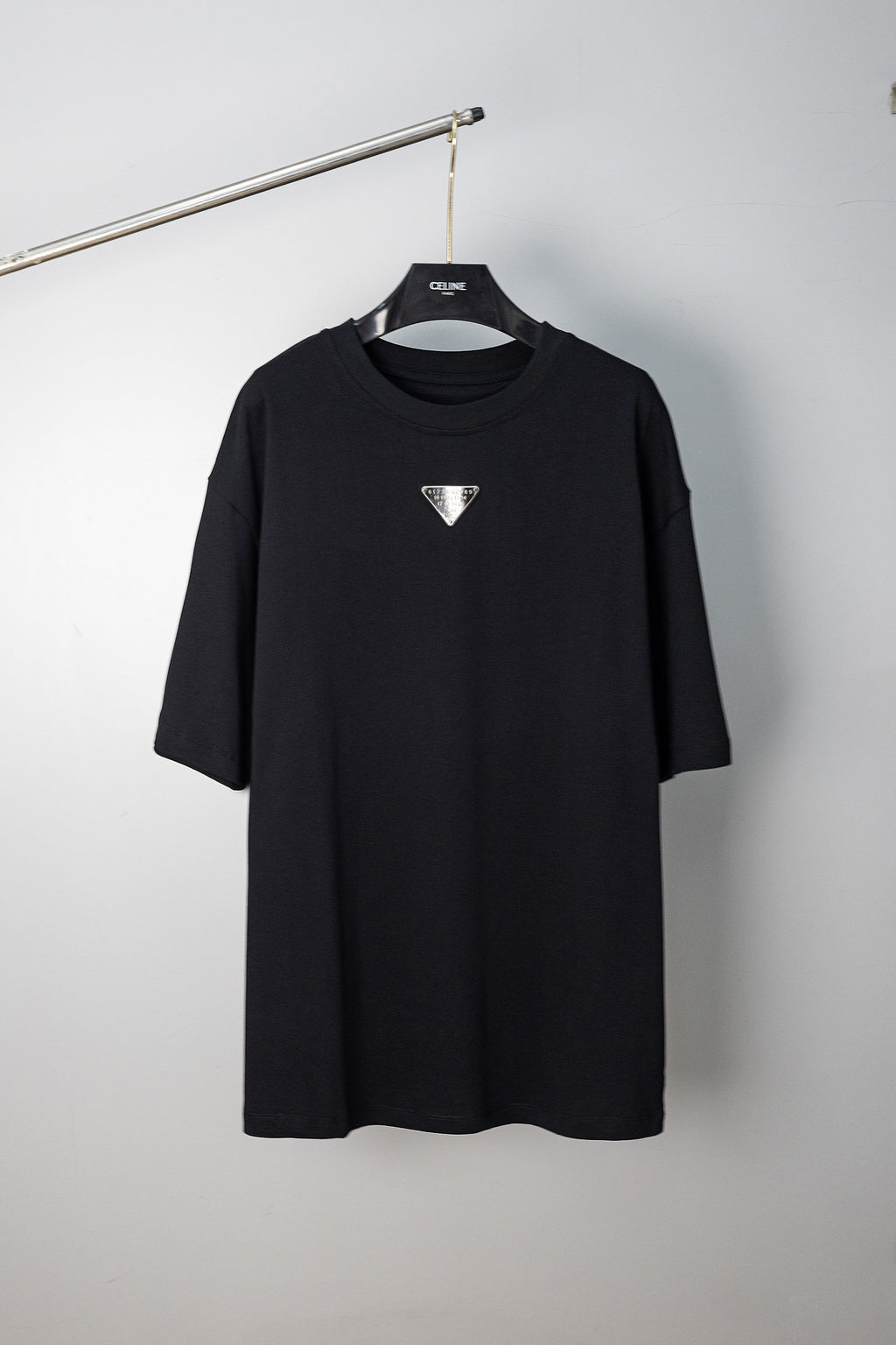 Maison Margiela black crew-neck T-shirt with small triangular logo on chest