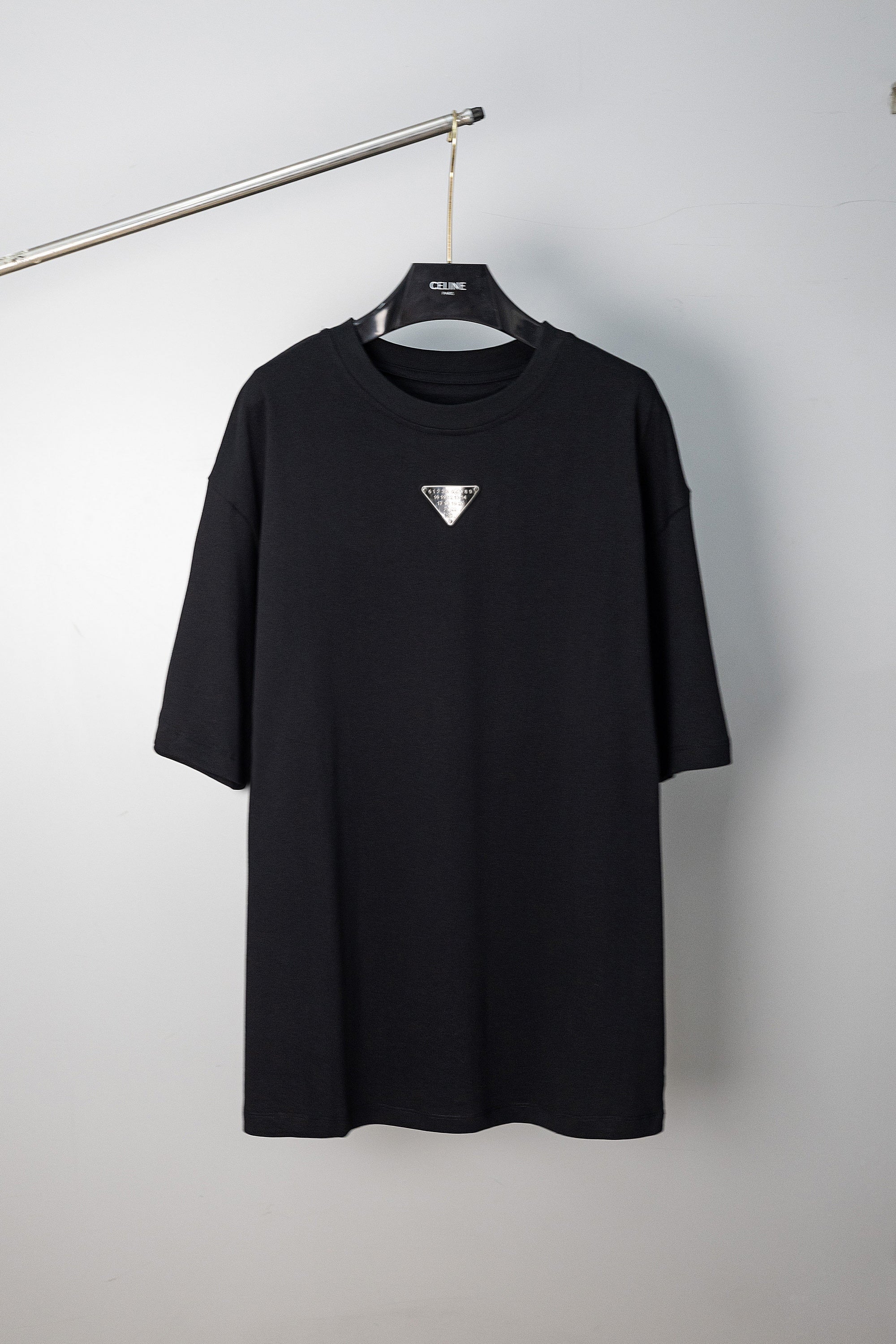Maison Margiela black crew-neck T-shirt with small triangular logo on chest