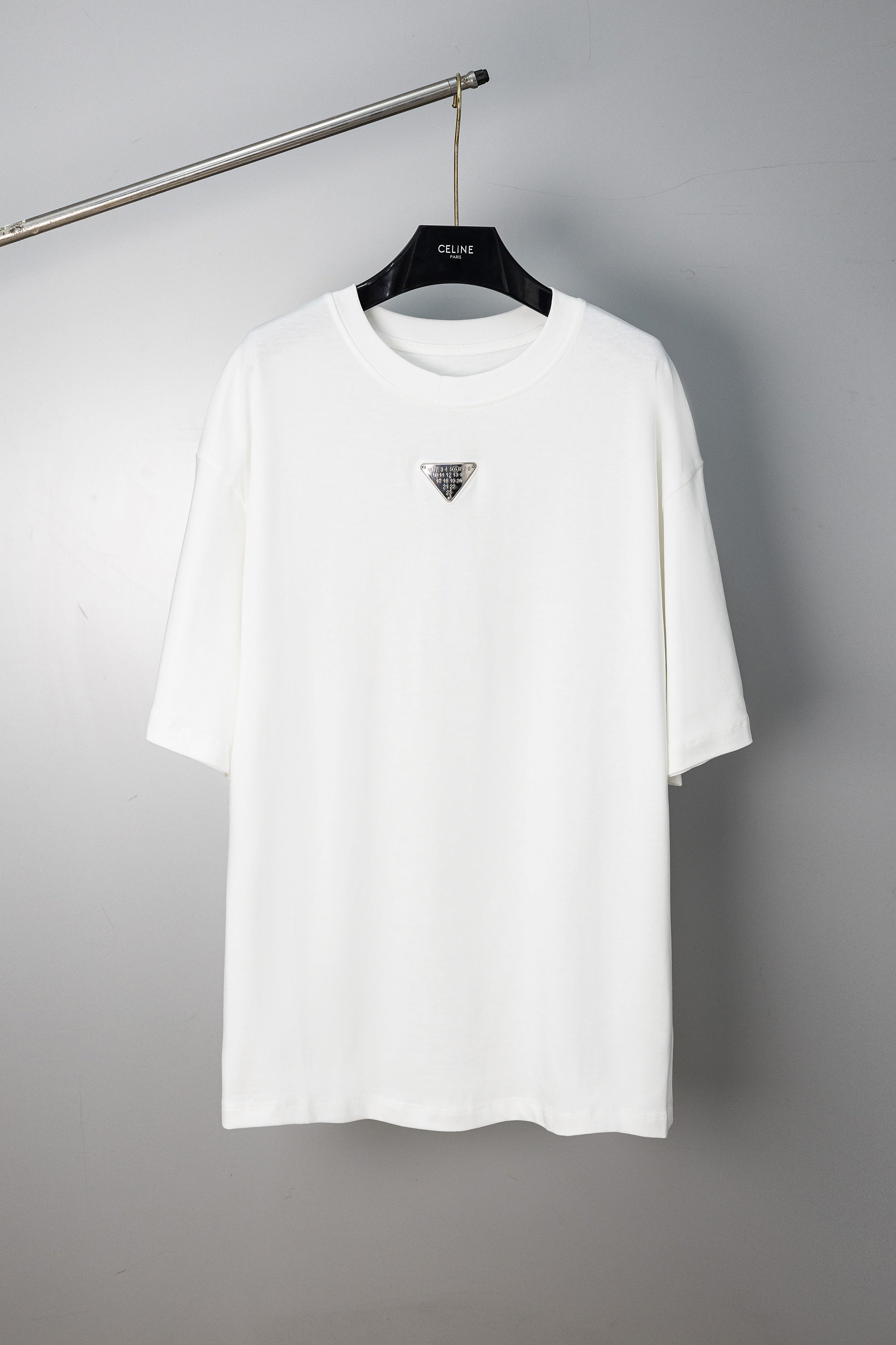 Maison Margiela white crew-neck T-shirt with small triangular logo on chest