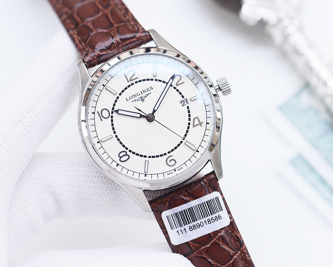 Longines wristwatch with white dial, brown leather strap, silver-tone case, barcode sticker
