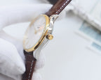 Longines wristwatch with gold-tone case, light dial, and brown leather strap
