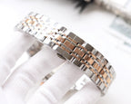 Two-tone metal watch bracelet with alternating polished and brushed links