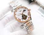 Two-tone watch with white dial, gold accents, and skeleton movement on metal bracelet