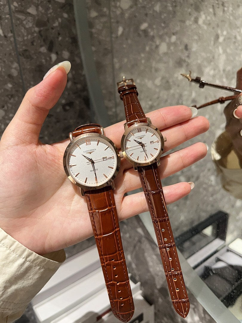 Longines watch with white dial and brown leather strap, round case on hand