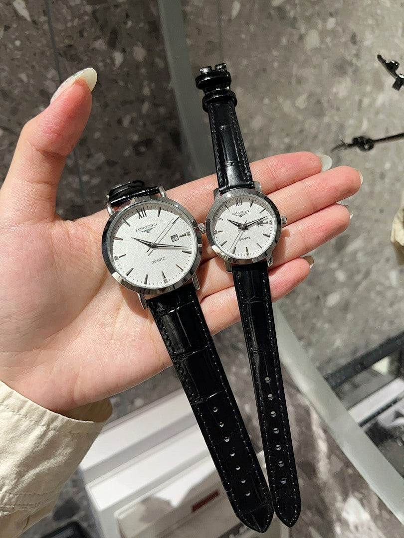 Longines watch with white dial and black leather strap, two round cases on hand
