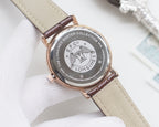 Quartz wristwatch with black dial and beige leather strap, round rose-gold case