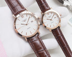 Quartz wristwatch set with white dials and brown leather straps, rose-gold cases