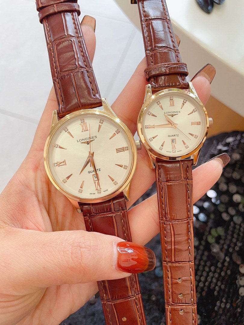 Longines watch pair with brown leather straps and gold cases, white dials
