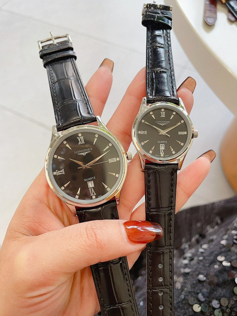 Pair of watches with dark dials, black leather straps, silver cases