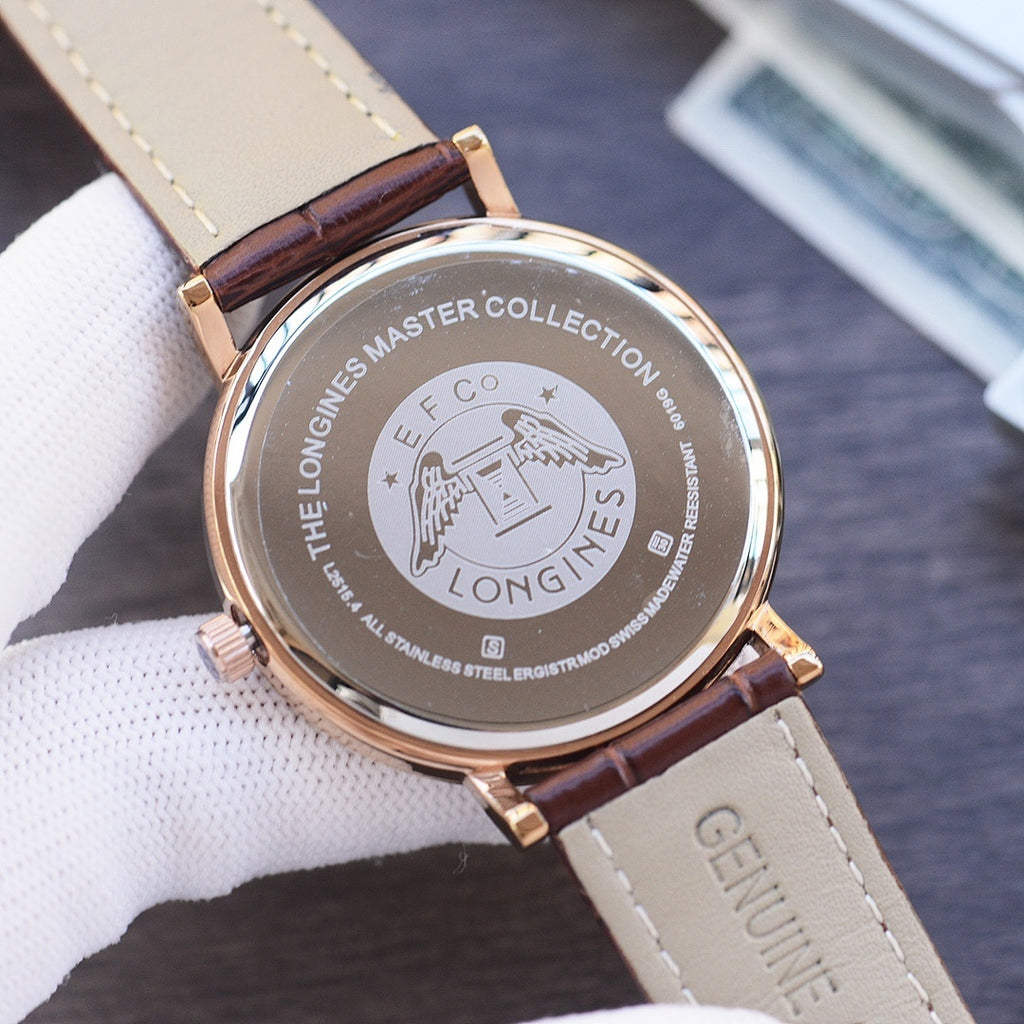 Quartz wristwatch back with engraved stainless steel case and brown leather strap