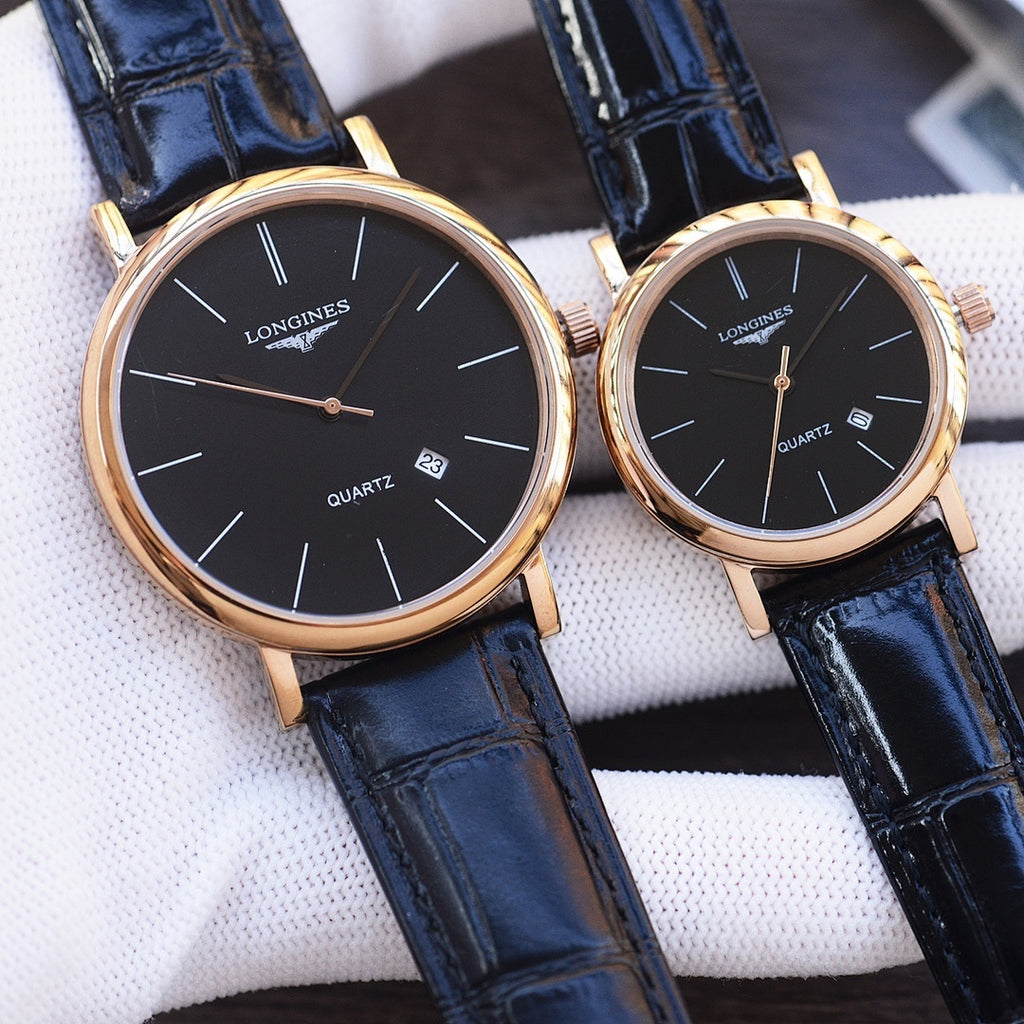 Quartz wristwatch pair with black dials, rose-gold tone cases, and dark blue leather straps