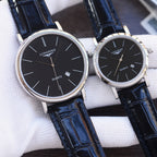 Quartz wristwatch pair with black dials and dark blue leather straps, silver-toned cases