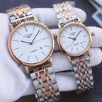 Quartz wristwatch pair with white dials and two-tone stainless steel bracelet straps