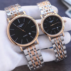 Quartz wristwatch pair with black dials, gold-tone bezels, stainless steel bracelet straps