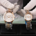 Longines quartz watch with rose-gold case and silver bracelet, white dial