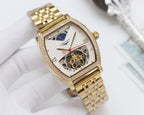 Gold-tone rectangular wristwatch with diamond bezel, openwork skeleton dial and red hands