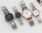 Longines watches with metal bracelets: black and dark dials plus white dials, four watches