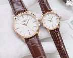 Rose gold Longines watches with white dials and brown leather straps, two watches side by side